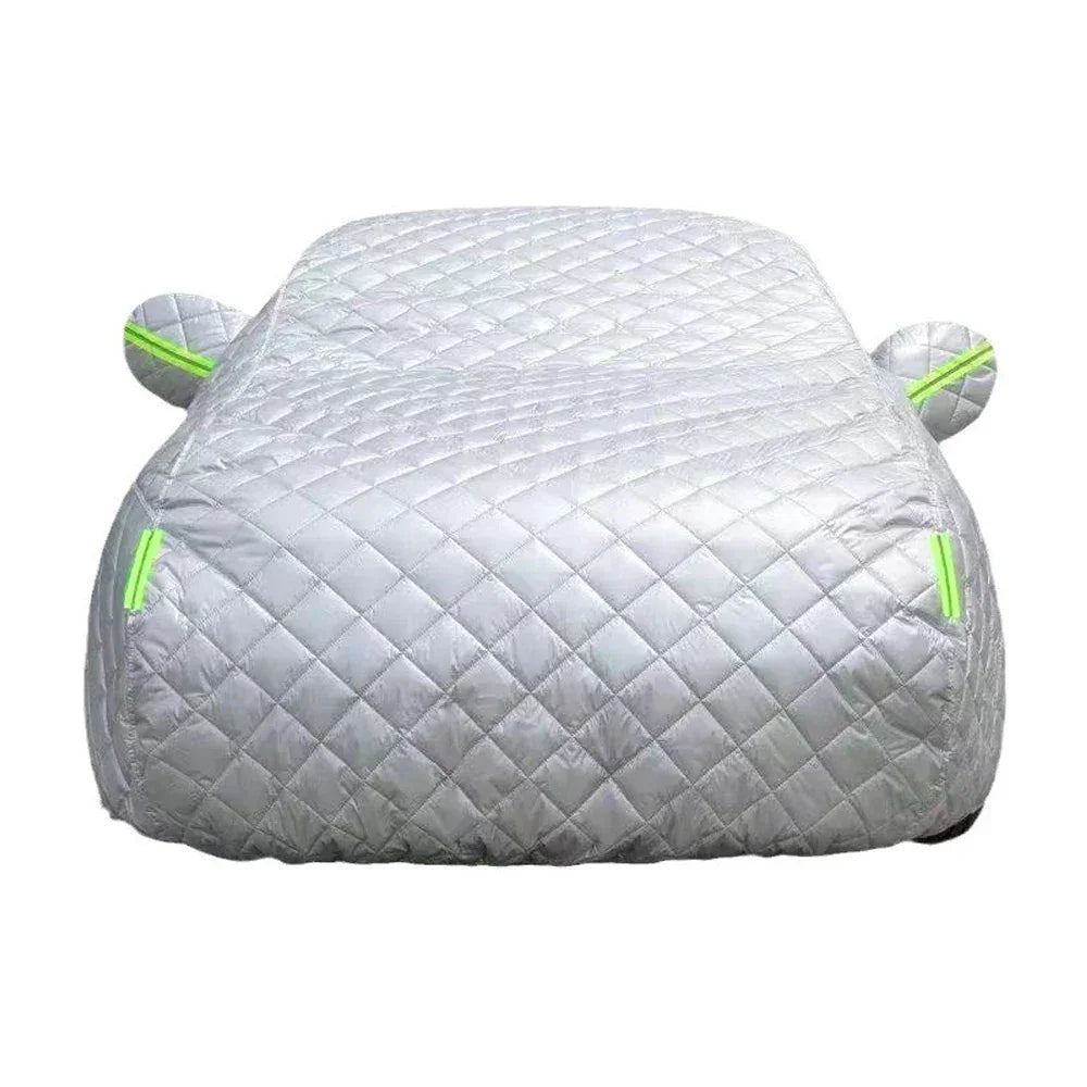 Silver quilted car cover with neon green trim for hail and weather protection