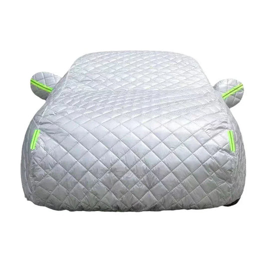 Silver quilted car cover with green trim for hail and weather protection